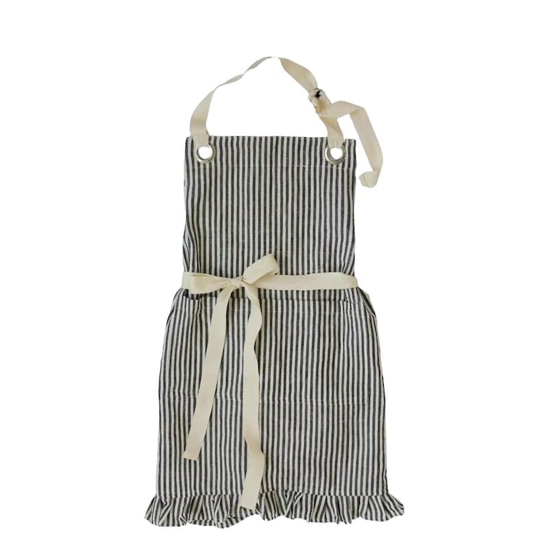 A black and white striped apron with a white ribbon tied around the waist.