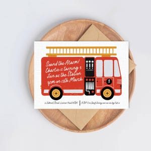 May include: A rectangular birthday invitation card featuring a red fire truck illustration with a yellow ladder on top. The text reads: Sound the Alarm! Charlie is turning 3 Join us the Station 3pm on 12th March. 25 Edmont Street, Lennox Head NSW | RSVP Fire Chef Jenny 0000 000 000 by Feb 10.