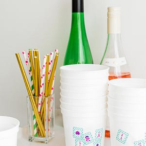 Mahjong birthday party decor featuring themed drinkware and bar setup