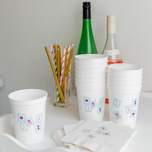 Cute Mahjong tile drink cups styled with party napkins and straws