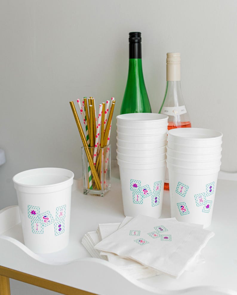 Cute Mahjong tile drink cups styled with party napkins and straws