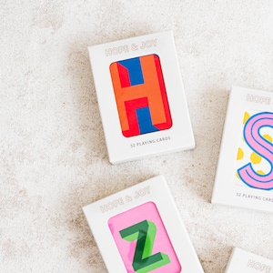 Customizable playing cards. Choose card color and colors for top and shadow layer of letters.  Personalized cards.
