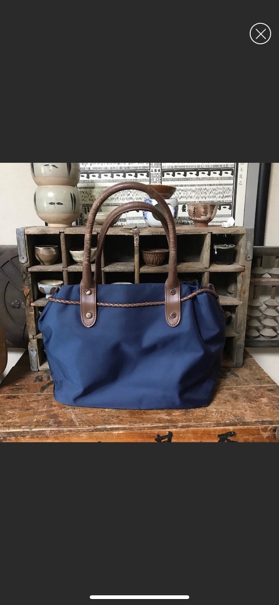 Agnes B blue nylon bag w brown leather trim