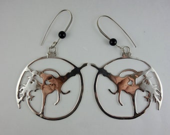 Beija Flor handmade silver earrings, capoeira moves, Afro-Brazilian culture.