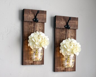 Rustic mason jar wall sconce set with flowers. Wooden wall plaque with hooks & greenery. Shutter wall decor