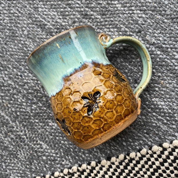 Handmade Bee Pottery Mug: Honeycomb Design, Sea Foam Blue Rim