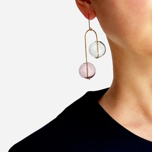 BALANCING ACT NO. 2_PK | clear earrings, circle earrings, minimal earrings, mobile earring , modern jewelry, sphere earrings, pink |