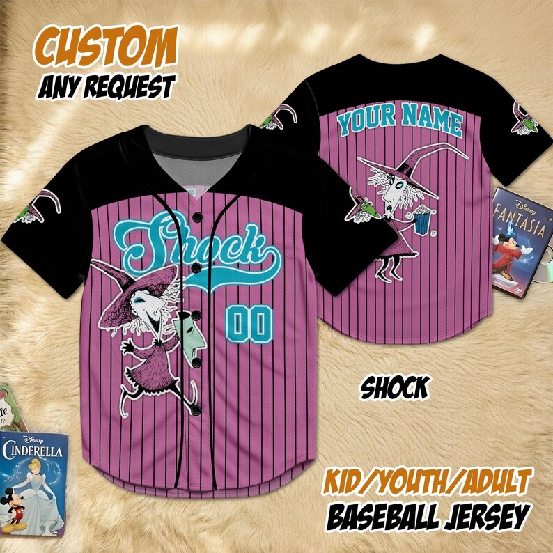 May include: Pink and black baseball jersey with vertical stripes, featuring a cartoon character and the name "Shock" in teal. The jersey has the number "00" and the text "Your Name" on the back. The text "Kid/Youth/Adult Baseball Jersey" is also visible.