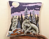Handmade pillow cushion with vintage embroidery of two wolves in the forest