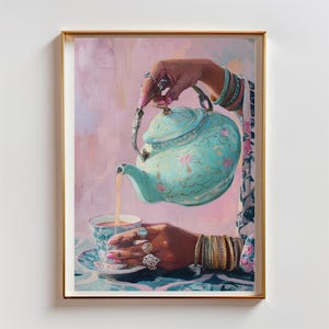 May include: A framed painting depicts a teal teapot pouring tea into a matching teacup. The teapot and teacup are adorned with floral patterns. The painting features a hand wearing rings and bracelets, holding the teapot. The background is a soft pink.