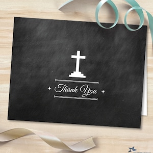 May include: Black and white thank you card with a white cross on a black background. The text "Thank You" is written in a white cursive font.