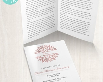 May include: A white card with a pink and gold floral design and the text "The Bat Mitzvah of Alexis Miriam Sternberg" with the date January 21, 2024 and the location Congregation Beth Yerushalayim, Reston, Virginia. Rabbi Richard M. Bernstein.