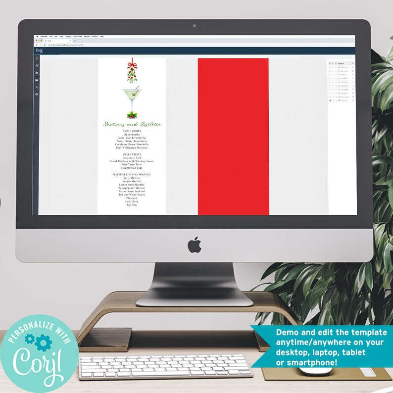 May include: A computer screen displaying a digital template for a Christmas party menu. The menu features a watercolor illustration of a martini glass with a mistletoe garnish. The text on the menu reads "Martini and Mistletoe".