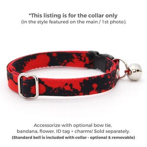 May include: A pet collar featuring a red and black paint splatter pattern, a black plastic buckle, a silver metal adjustment slider, and a small silver bell. Text reads: *This listing is for the collar only (in the style featured on the main / 1st photo). Accessorize with optional bow tie, bandana, flower, ID tag + charms! Sold separately. (Standard bell is included with collar - optional & removable)