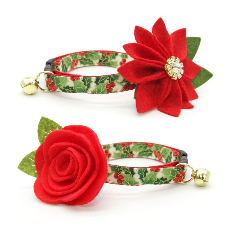 May include: Two red felt flower cat collars with a green and red holly pattern. One collar features a poinsettia flower with a rhinestone center and the other features a rose.