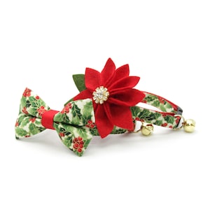 May include: A red poinsettia flower with a gold rhinestone center and a green holly leaf pattern bow tie and collar set for a cat.