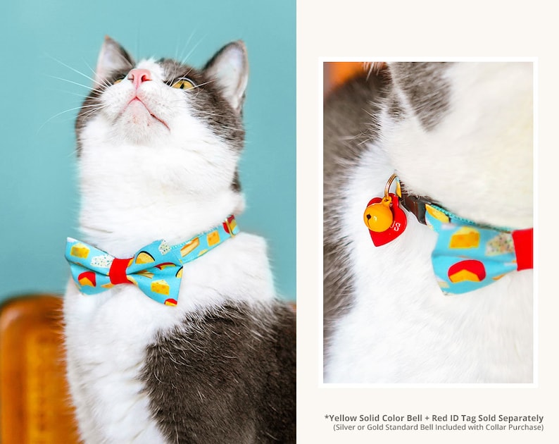 May include: A white and gray cat wearing a blue and red bow tie with a cheese pattern. The bow tie has a red bell attached to it. *Yellow Solid Color Bell + Red ID Tag Sold Separately (Silver or Gold Standard Bell Included with Collar Purchase)