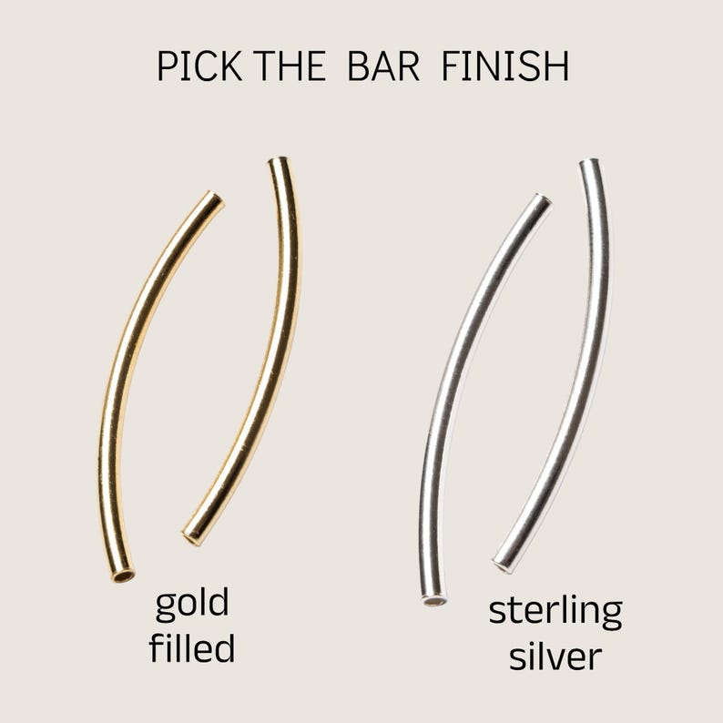 May include: Two curved metal bars, one gold filled and one sterling silver, for jewelry making.
