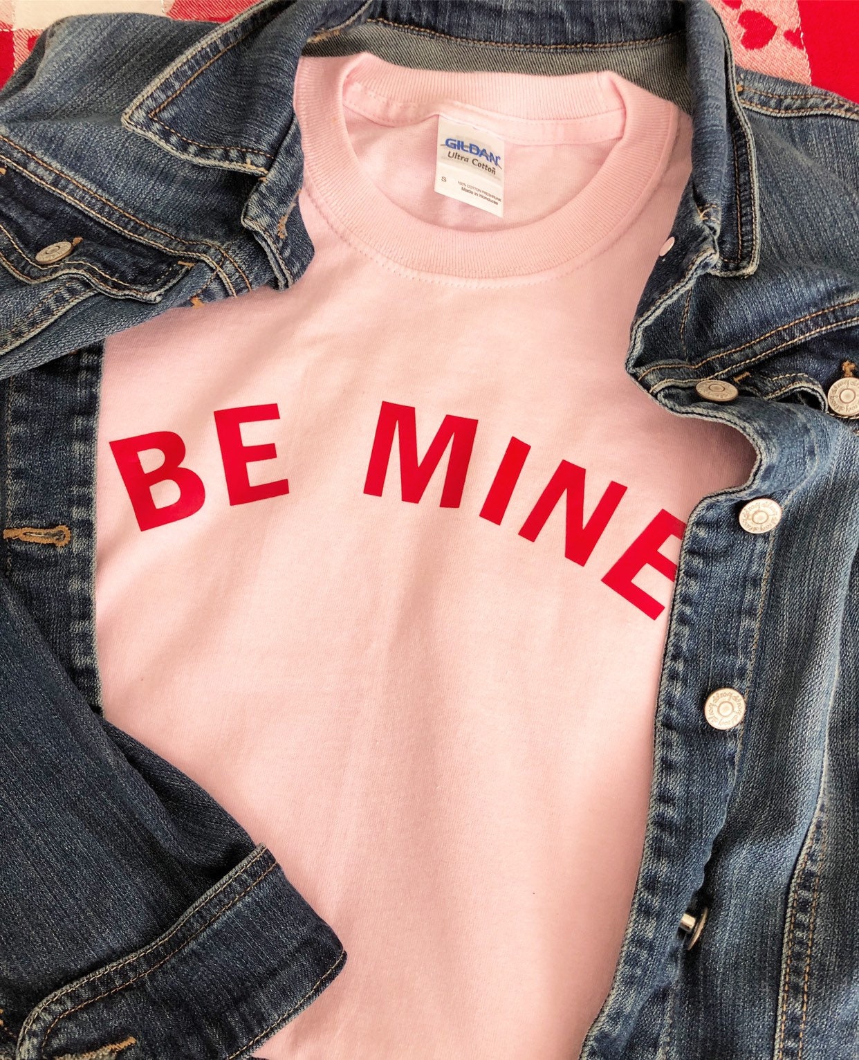 pink t shirt red writing