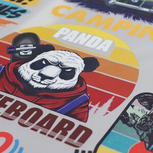 A close-up of a vibrant DTF print featuring a stylized panda in a red hoodie holding a skateboard. The background includes a retro sunset gradient with 'PANDA' and 'CAMPING' text.