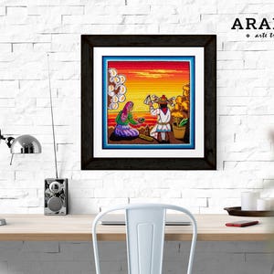 May include: A framed artwork depicting a colorful scene of two people sitting on a beach at sunset. The artwork is in a black frame and has the text "ARAMARA arte tradicional" in the top right corner.