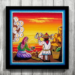 May include: A colorful embroidered artwork depicting two figures in traditional clothing against a sunset backdrop. The woman wears a purple dress and a red headscarf, while the man holds a stick with feathers. The scene is framed by a blue and brown border.