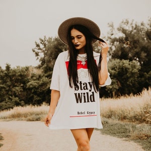 *BestSeller!!
You know the girls who always look like they're off to a music festival? These are the clothes they wear ✊ Our Stay Wild Concert Tee/Dresses are wider and oversized for the ultimate Stagecoach look!