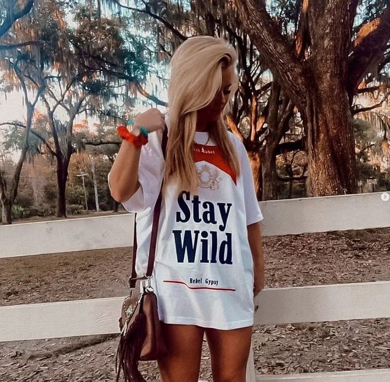 *BestSeller!!
You know the girls who always look like they're off to a music festival? These are the clothes they wear ✊ Our Stay Wild Concert Tee/Dresses are wider and oversized for the ultimate Stagecoach look!