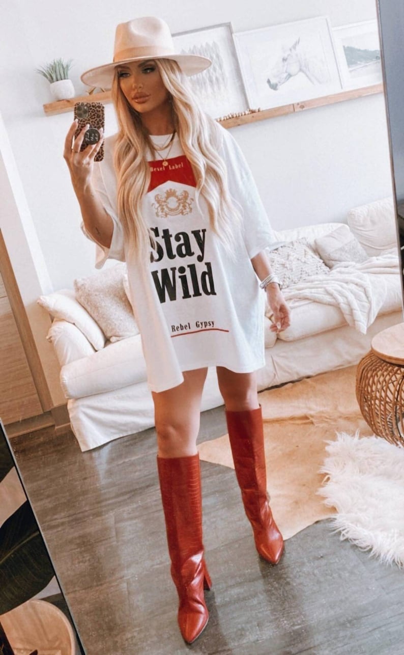 *BestSeller!!
You know the girls who always look like they're off to a music festival? These are the clothes they wear ✊ Our Stay Wild Concert Tee/Dresses are wider and oversized for the ultimate Stagecoach look!