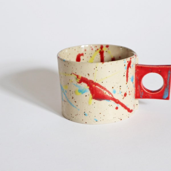 Handmade and hand-painted ceramic cup for tea or coffee with handle