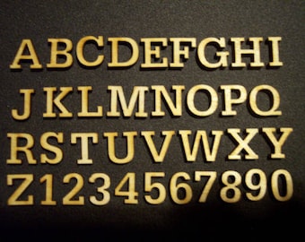 May include: A set of wooden letters and numbers in a serif font. The letters are uppercase and the numbers are in a standard font. The letters and numbers are all the same size and are arranged in three rows. The letters are A-Z and the numbers are 1-9 and 0.