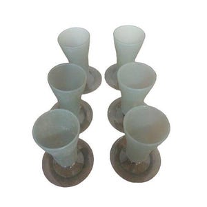 May include: Six frosted glass vases with a flared top and a circular base. The vases are arranged in two rows of three, showcasing their elegant design. The soft, muted color of the glass adds a touch of sophistication.