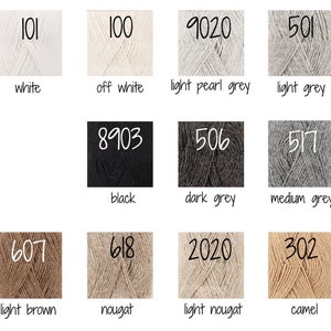 May include: A color chart of yarn samples with corresponding numbers and names. The colors include white, off white, light pearl grey, light grey, black, dark grey, medium grey, light brown, nougat, light nougat, and camel.