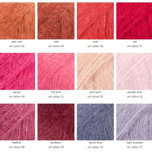 May include: A color chart showing 12 different shades of yarn. The colors include pale rust, rust, coral, red, cerise, hot pink, pink sand, powder pink, heather, bordeaux, denim blue, and light lavender.