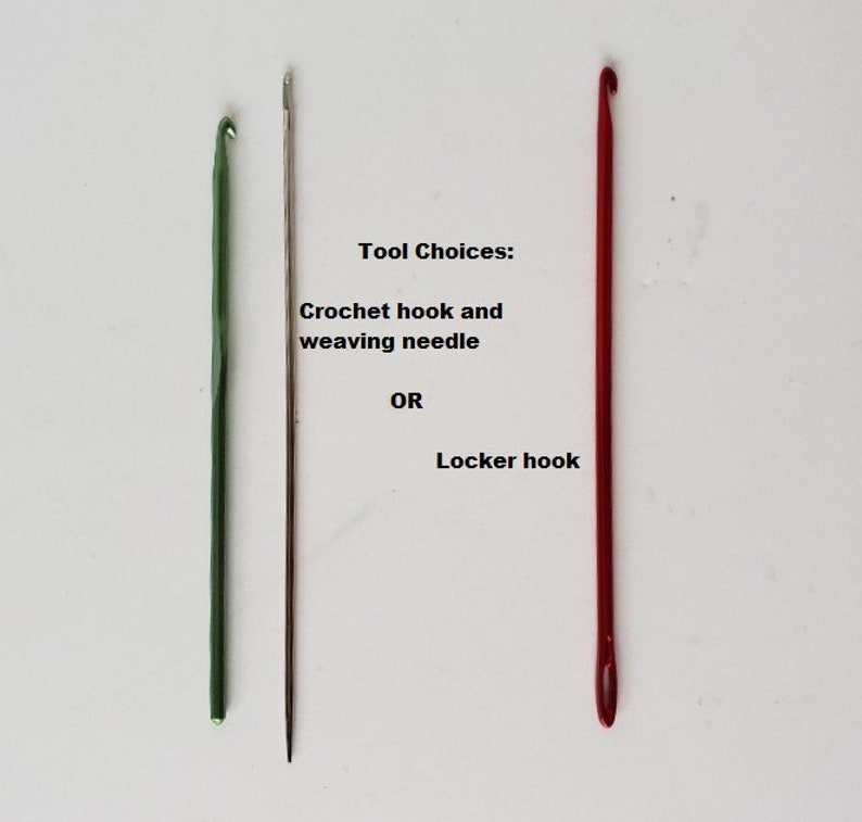 May include: Three tools for crafting: a green crochet hook, a silver weaving needle, and a red locker hook. Tool Choices: Crochet hook and weaving needle OR Locker hook.