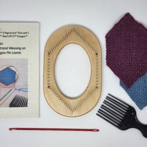 May include: A wooden oval-shaped loom with a row of pins around the edge. There are two woven squares, one blue and one burgundy, a red crochet hook, a black comb, and a set of instructions for continuous strand weaving on TURTLE Hexagon Pin Looms.