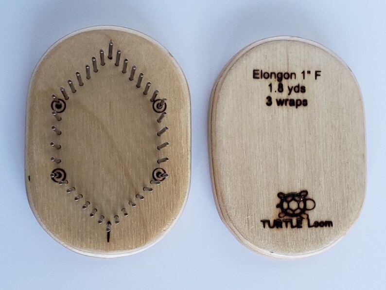 May include: A wooden oval-shaped knitting loom with 32 pegs. The loom is labeled "Elongon 1" F 1.8 yds 3 wraps" and "TURTLE LOOM" with a turtle logo.