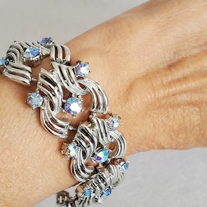 1945 Coro Pegasus bracelet featuring blue Aurora Borealis stones set in silver-tone w/ expansive open panels