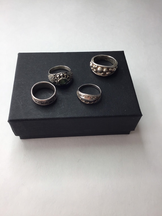 A four-piece collection of Silver rings