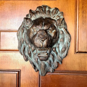 Garden lion wall, fence or gate bronze patina sculpture for your home inside or outdoor.
