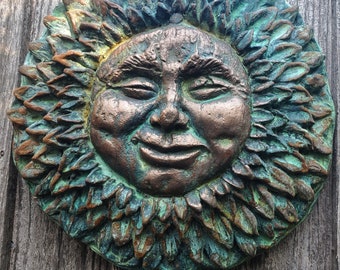 Sunflower face cement casting and hand finished in bronze and copper by Gable Gargoyles