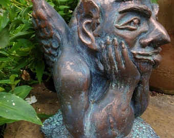 Gargoyle cast in a cement blend, hand finished in a bronze with a tiffany green patina by Gable Gargoyles.