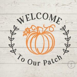 May include: Welcome to Our Patch sign with a black and white pumpkin and leafy vines on a white wood background.