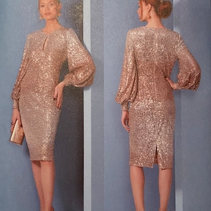 Könnte beinhalten: Vogue Patterns Schnittmuster V1841 für ein Paillettenkleid mit langen Ärmeln und einem Schlüssellochausschnitt. Das Schnittmuster wurde von Badgley Mischka entworfen und in den USA gedruckt.