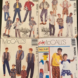 May include: Four McCall's sewing pattern envelopes for children's clothing, including numbers 4949, 4917, 6755, and M4364. Each envelope displays illustrations of various shirts, pants, vests, and shorts, along with the Fashion Basics and Kidstuff logos.