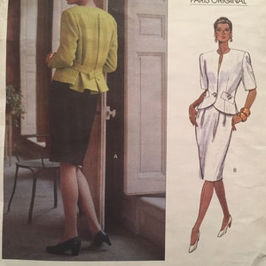 May include: A vintage Vogue Patterns sewing pattern for a jacket and skirt by Christian Dior. The pattern is for an advanced sewing project and includes instructions for both a green and white version of the outfit. The pattern number is 2365.