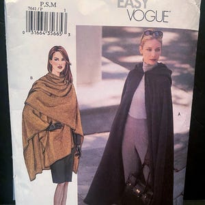May include: A Very Easy Vogue sewing pattern envelope 7641 featuring illustrations of two garments: a tan wrap-style poncho labeled B and a long black hooded cape labeled A. The envelope includes a barcode and the text 7641 PATTERN/PATRON.