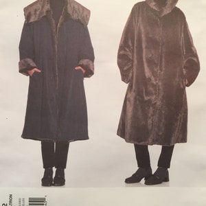 May include: A sewing pattern for a long, brown, faux fur coat with a hood. The pattern is by Issey Miyake and is for Vogue Designer Original.