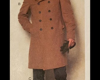 May include: Vogue Patterns advertisement showing a man in a double-breasted, knee-length brown coat. The coat has large black buttons and a wide collar. The man is wearing dark trousers and brown shoes. The text "VOGUE PATTERNS" is at the top. The bottom reads "Designed and printed in USA."