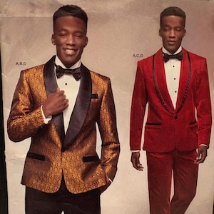 May include: Simplicity pattern S8899 AA featuring two formal suit designs. One suit is gold with a black lapel, the other is red. The pattern includes sizes 34-42 US, 44-52 Euro, and 44-52 French.